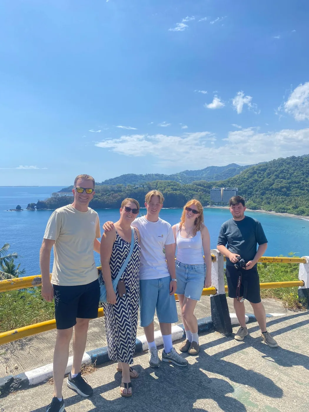 Family of five at a coastal viewpoint on a private Lombok day tour